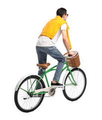 Man in sunglasses riding bicycle with basket on white background