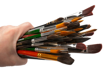 Mix of paint brushes in a row isolated on a white background.  Top view.
