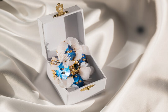 Handmade brooch with mother-of-pearl buttons in a box