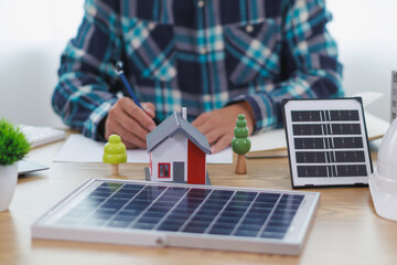 Engineers are reviewing plans from architects to prepare to install solar panels and wind turbines...