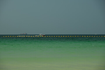 sea ​​horizon and a large ship in the distance, Thailand