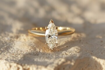 Fototapeta premium Luxury gold ring design with clear diamond on stone background with shadows