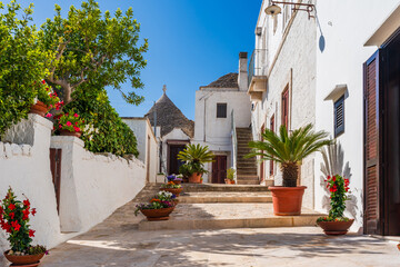 Famous traditional old dry stone trullo house with conical roof in Alberobello, Italy.