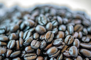 Closeup of pile of dark coffee beans