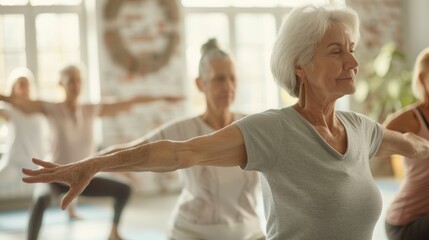Fototapeta premium Seniors Practicing Yoga for Joint Pain Relief in Bright, Airy Studio Setting