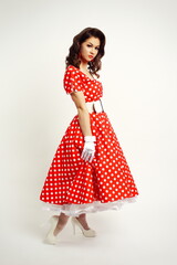 woman wearing vintage polka dot red dress