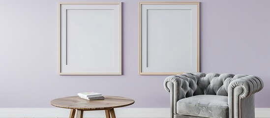 Two square frames on a light lavender wall in a living room with a light gray velvet armchair and a round wooden coffee table.
