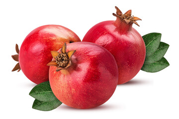 Three ripe pomegranate fruit with green leaf