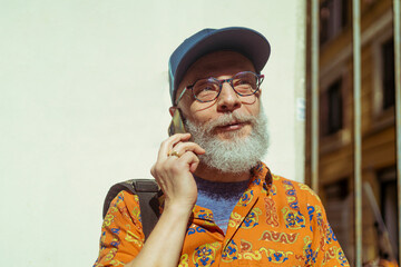 Modern senior embracing remote work lifestyle in the city