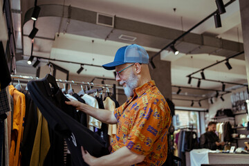 Senior Man Exploring Fashion in Boutique