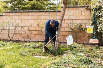 Man working with shovel on gardening maintenance