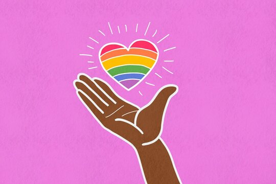Hand holding a vibrant rainbow heart illustration for Pride Day