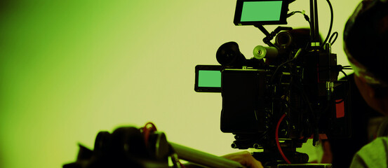 Filmmaker crew team with professional cinema equipment and video camera on the set. Film director...