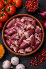 Raw chicken hearts with salt, spices and herbs