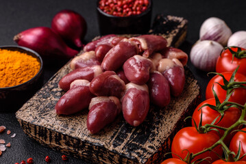 Raw chicken hearts with salt, spices and herbs