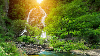 Beauty in nature, amazing waterfall in tropical forest of national park, Thailand