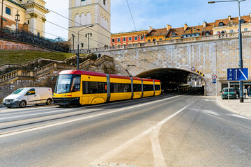 Fototapeta premium Modern tram on the street of Warsaw, Poland