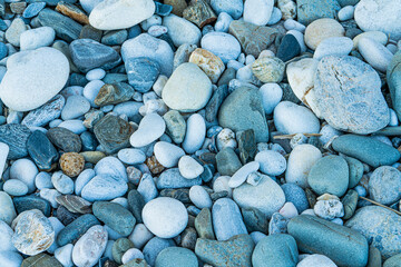 Smooth round grey pebbles, background. Pebble sea beach closeup