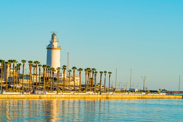 Obraz premium Views of the lighthouse in the port area of Malaga. Andalusia, Spain