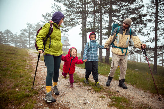 Young family hiking in the forest