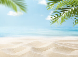 summer beach background of sand, sea and palm leaves