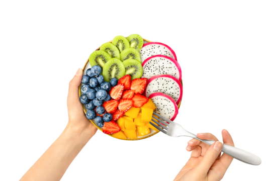 plate with sliced ​​fruits and berries in the hands of a woman, top view, on a white isolated background