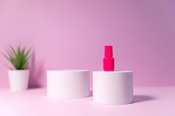 Minimal layout with a podium for product demonstration. Abstract white background of geometric shape on a minimalistic pink background.