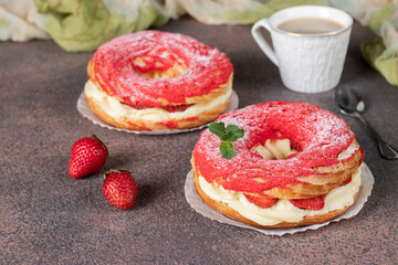 French dessert Paris-Brest made from choux pastry, strawberries and custard