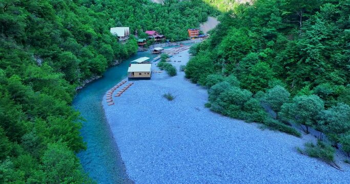 Aerial video of Shala river and its clear blue waters with lush forests in northern Albania. 