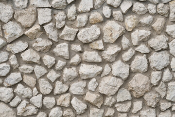 Natural stone wall as abstract texture background.