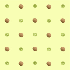 Seamless pattern of alternating whole and halved kiwi on a yellow background