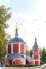 Summer views of the ancient Russian city of Suzdal. Assumption Red Church with a bell tower...