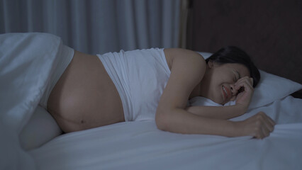 Depressed lonely Asian pregnant divorce woman in bedroom at home. Having a baby. Family people lifestyle. Mom.