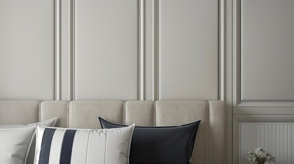 striped pillows on a bed with a grey fabric headboard, focusing on a closeup shot in the bedroom.