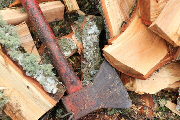 an old ax and birch firewood
