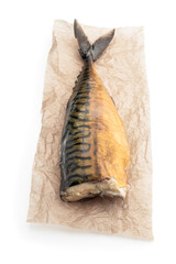 Hot smoked mackerelfish on baking paper isolated on a white background