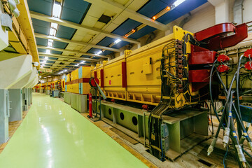 Experimental equipment of hadron collider in long corridor.