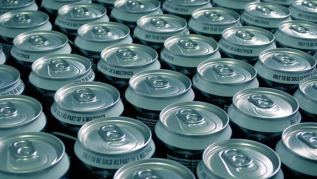 Soda Cans Lined Up Moving Shot
