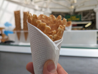 sugar, waffle cup, ice cream cone wrap a napkin in the store.
