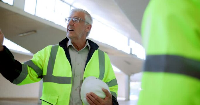 Mature man, architect and handshake with meeting in deal, partnership or agreement at site. Male person, mentor or engineer shaking hands with colleague for architecture, b2b construction or building