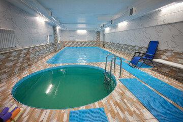 Indoor swimming pool with water chair for leisure and recreation