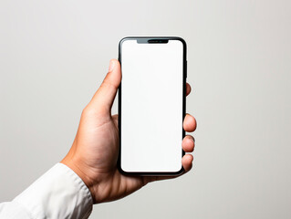 Male hand holding a smartphone with blank screen ready to place your design.