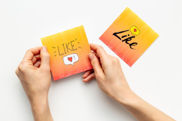 Hands holding Like and share icons for social media. Digital marketing concept