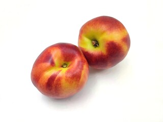Top view of two fresh nectarines, isolated on white background.