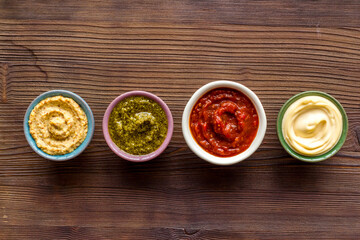 Many different sauces in bowls. Food or cooking background