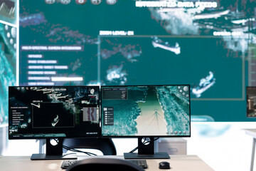 Government agency general headquarters empty command post with big screen monitoring satellite...