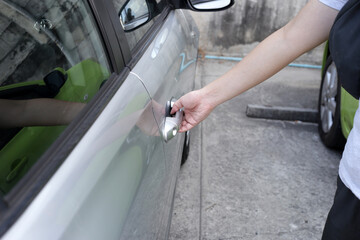 Male hand opening car door