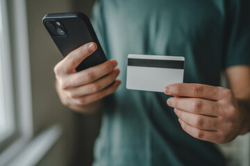 teenager young man at home use credit card shopping online e-banking