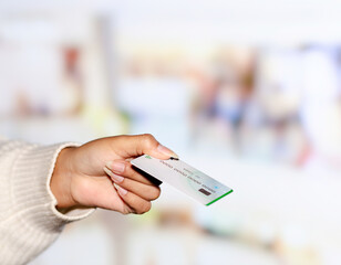 Hands Holding a Wallet and Credit Card. Copyspace. Selective focus