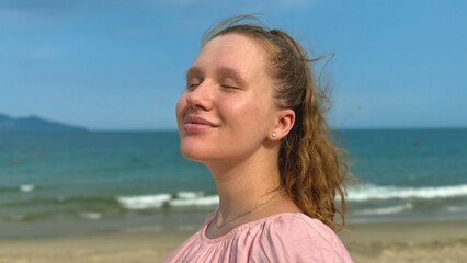 Happy young woman enjoy freedom at summer vacation on sea, beach 